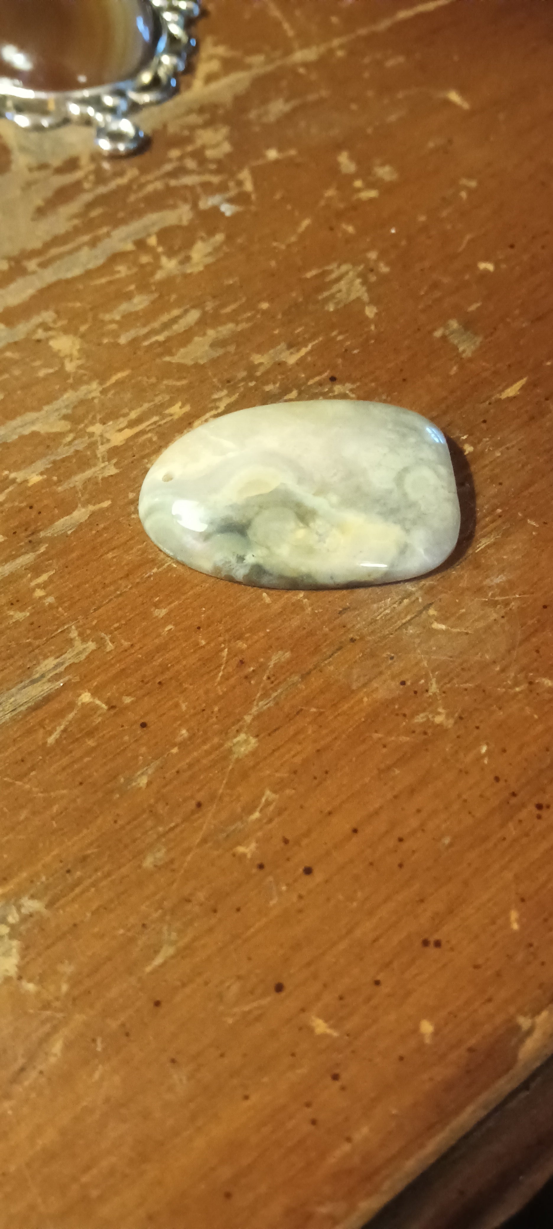 Translucent agatized drusy chalcedony, clear and white with intricate patterns, freeform, polished, handcrafted one of a kind gemstone pendant. Rockhound Studio.