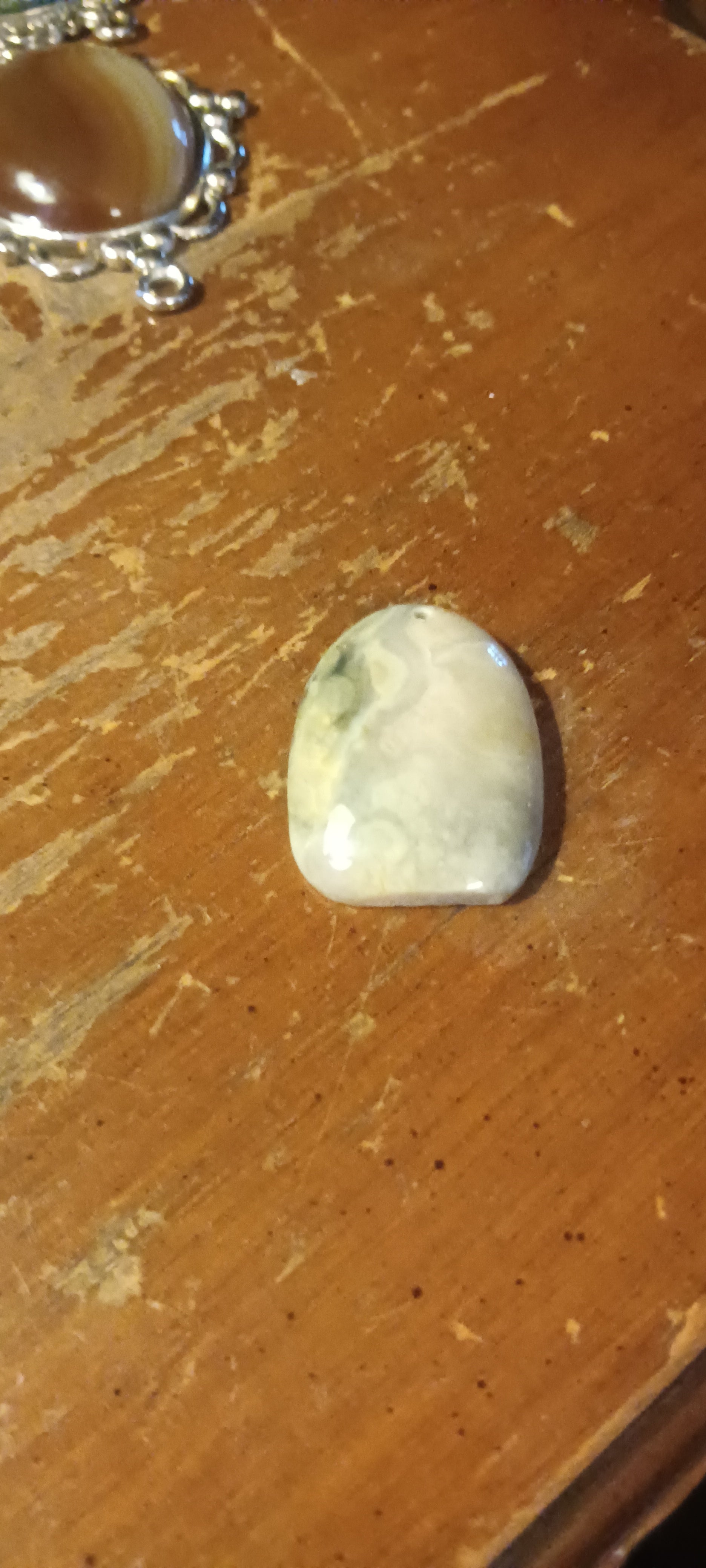 Translucent agatized drusy chalcedony, clear and white with intricate patterns, freeform, polished, handcrafted one of a kind gemstone pendant. Rockhound Studio.