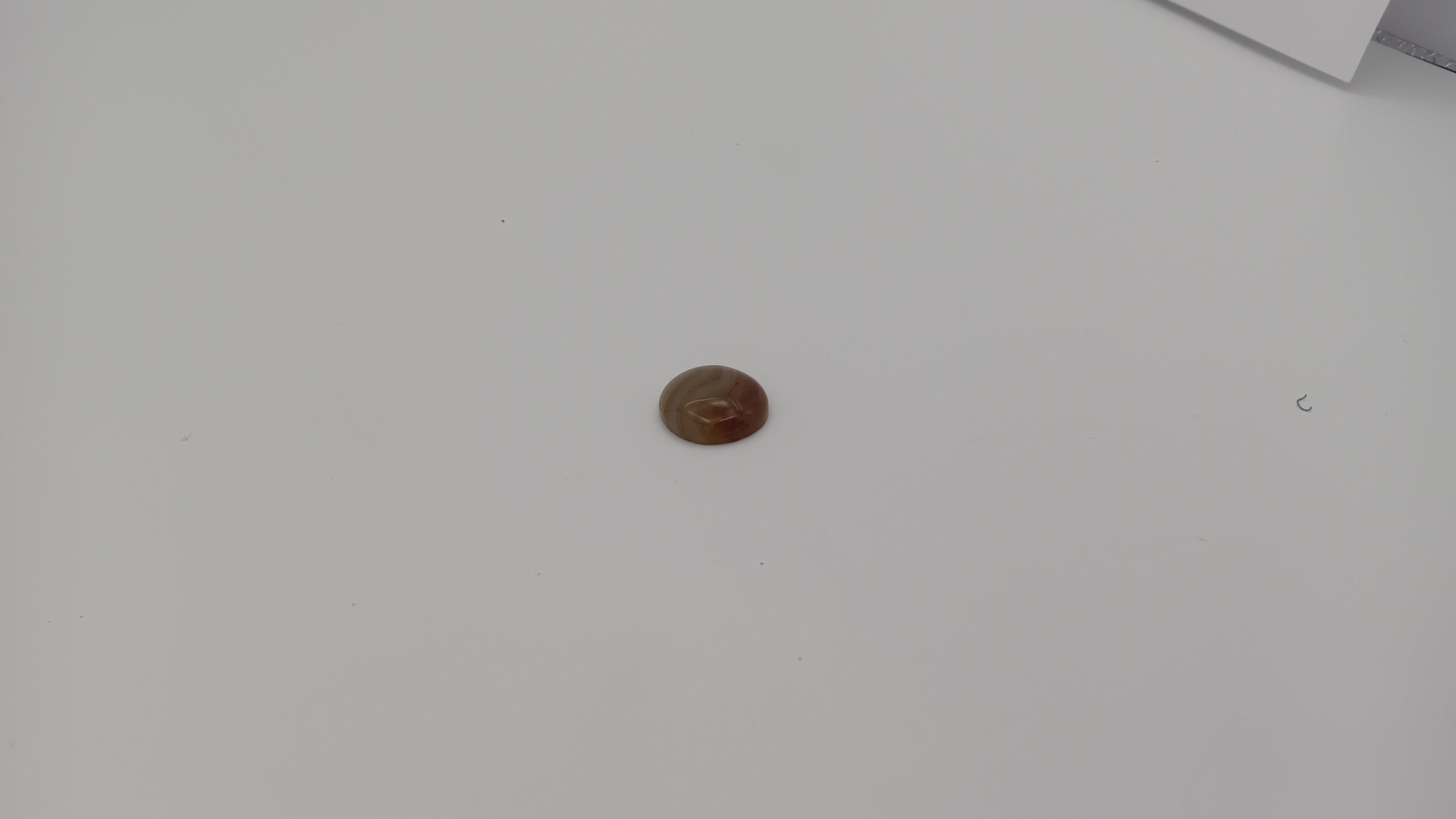 Botswana agate round side view showing caramel grey wave pattern by Jones Stones USA
