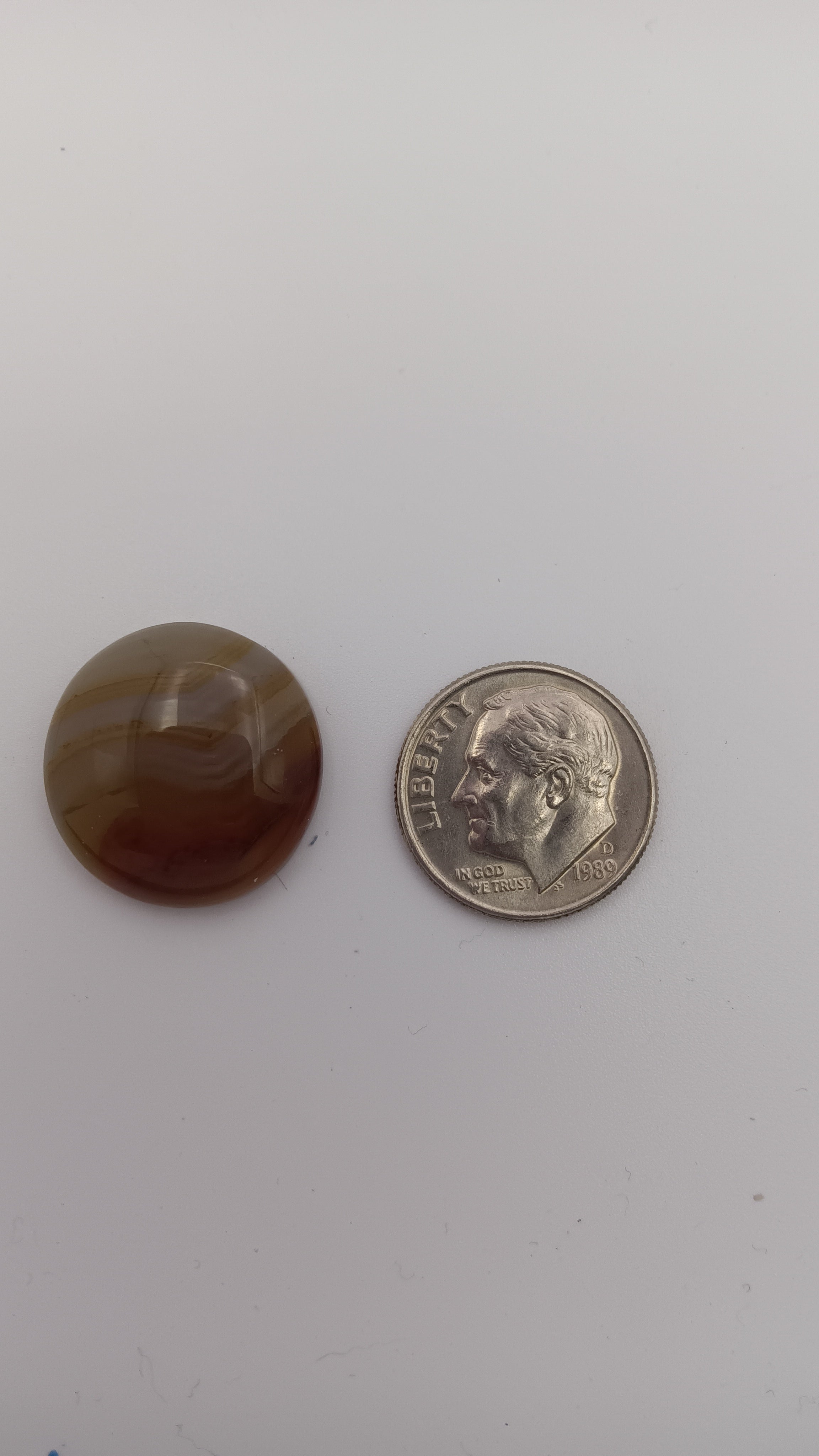 Botswana agate round 19mm size comparison with coin by Jones Stones USA
